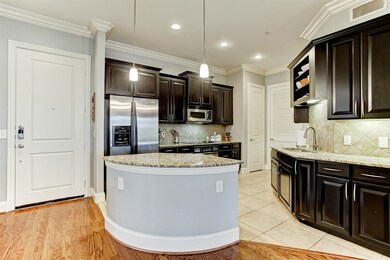 The spacious kitchen features granite countertops,