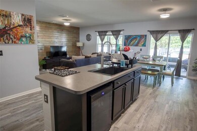 View of Kitchen, Dining Room and Family Room.