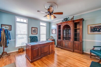 This large dining space has floor to ceiling windo