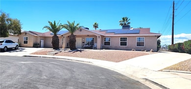 Single story home with stucco siding and solar pan