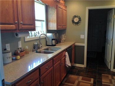 Upgraded quartz counters in the kitchen and under mount sink makes for a great working space.  Bosch stainless dishwasher conveniently near sink.