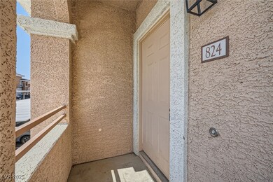 Entrance to property with stucco siding and a balc