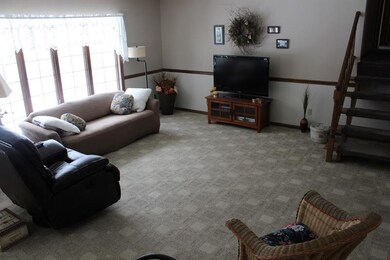 A large living room with Anderson Windows overlook
