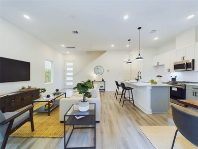Open concept kitchen, dining, and living - ideal f
