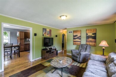 Living room opens up to dining area.