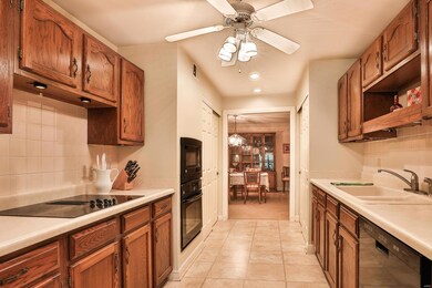 Appliances include smooth electric cook top, down 