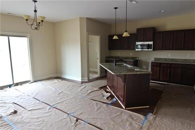 Open kitchen with eat-in area.