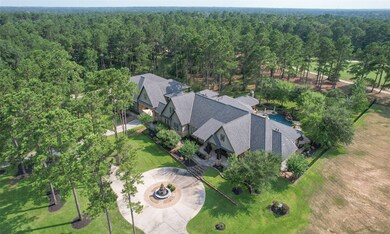 Drone view to see just how large the house and mancave are! Nice mature trees sprinkled throughout the lot. House is complete with a 20 KW generator.