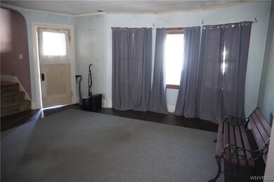 Living room LOOKING at front window.