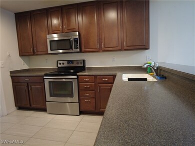 Kitchen featuring sink, stainless steel appliances