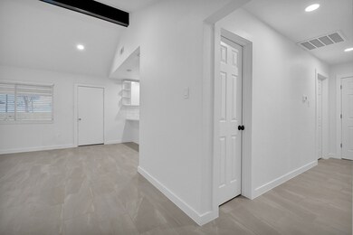 Entry way to the hall of 2 bedrooms and utility ro