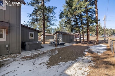 Fenced backyard featuring a shed and a patio area