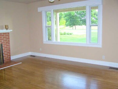 Another view of den with vinyl windows.