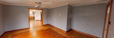 Living room, looking into dining room and kitchen