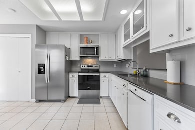 Kitchen featuring stainless steel appliances, dar
