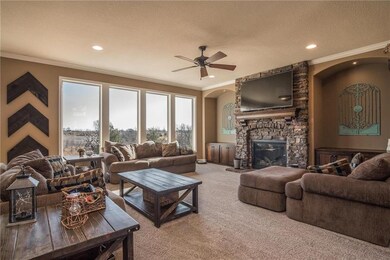 The stone fireplace and beautiful built-ins make t