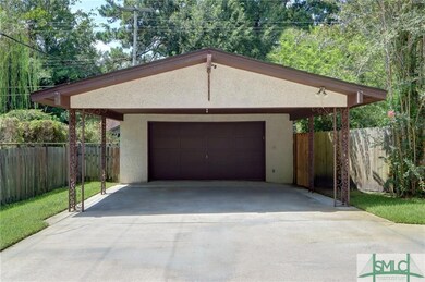 Detached double garage and carport with additional