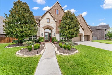 Four car tandem garage with plenty of room for shelving and epoxy flooring.