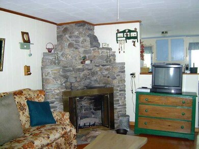 Living Room. Wood-Burning Fireplace...