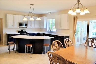 Breakfast room and kitchen with butterfly island