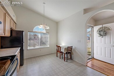 Front entry with archway into the vaulted eat-in k