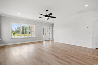 Unfurnished living room with a ceiling fan, basebo