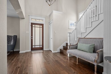 Enter the home to a two-story foyer with a formal living room on the right (can also be used as a formal dining room).