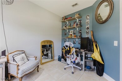 Home office featuring light tile patterned floors