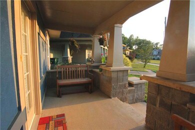 Watch the sunset from the charming rocking chair front porch. Decorative columns and stone framework overlook the freshly landscaped front yard, shrubs, and colorful flowerbeds.