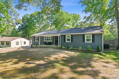 Single story home featuring a front lawn
