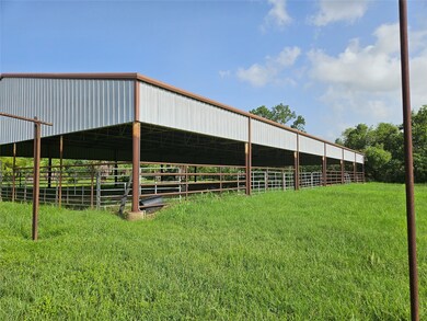 Covered light riding arena.