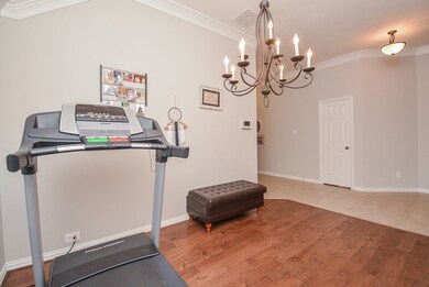 Large formal dining room just as you walk in off the entry with elegant chandelier.