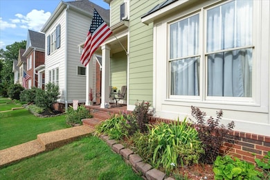 Doorway to property with a yard