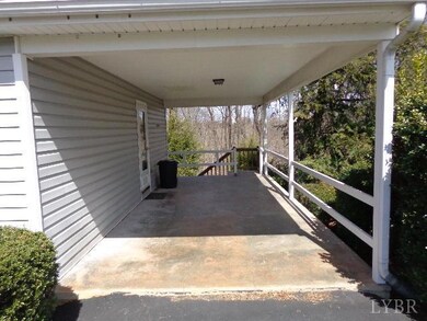 Carport and stairs to terrace level deck