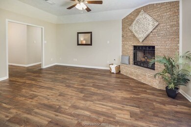 Living room anchored by fireplace