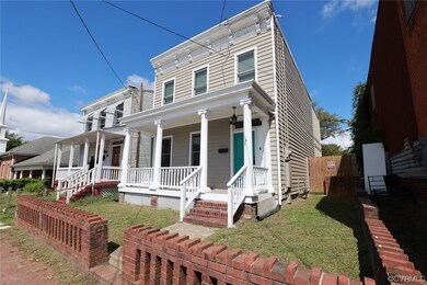 View of front of house featuring a porch and a fro