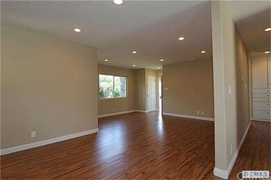 Open floorplan view into living room from kitchen 