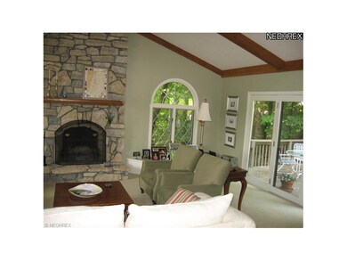 Serene wooded views are visible from every window.