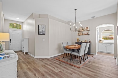 FOYER & DINING ROOM LEADING INTO KITCHEN