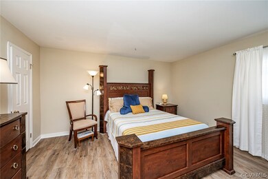 Primary Bedroom with laminate wood-style flooring