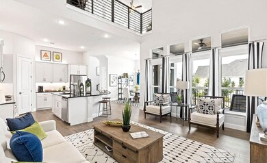 Living room featuring a towering ceiling, hardwood