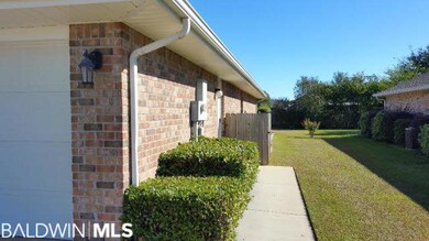 Side walk to the walk out door of the garage.