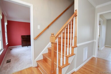Center foyer with raised ceilings and refinished w