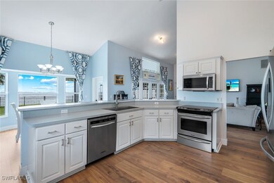 Kitchen featuring stainless steel appliances, a si