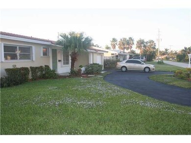 Covered porch and circular driveway.