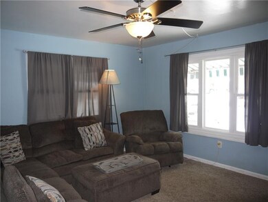 SPACIOUS FAMILY ROOM WITH LARGE PICTURE WINDOW.