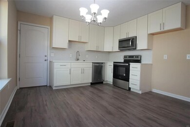Custom white shaker kitchen cabinets with soft clo