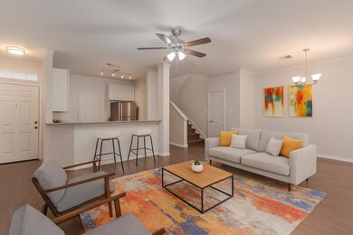 Living area with dark wood-style floors, a ceilin