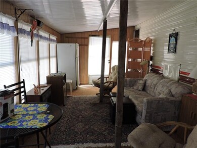 Interior of Screened-in porch.  Center Wood Braces