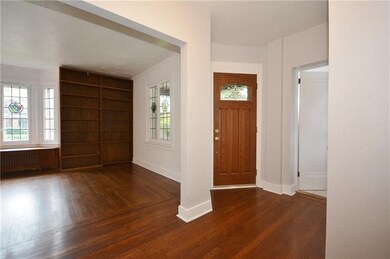 Entry opens to living room and dining room and fir